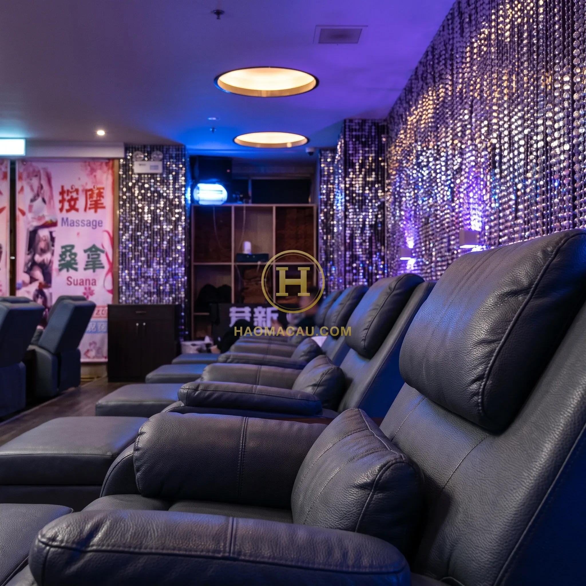 Golden Phoenix Sauna – Violet-lit recliner lounge